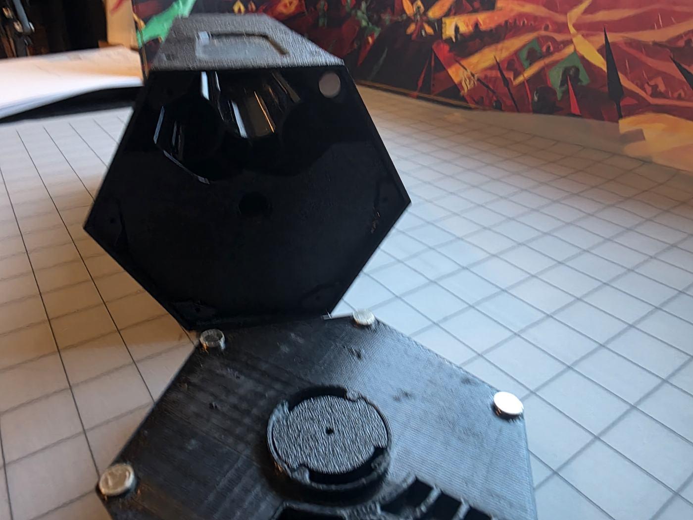 The Scent Engine opened up, showing printed layers and magnets inside