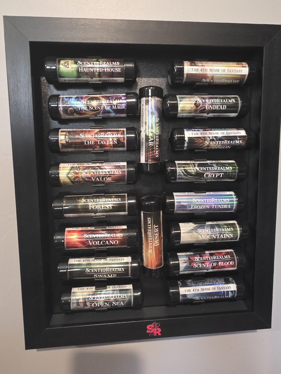 A framed wall display of ScentedRealms scent vials, including Scent of Blood, Undead, Tavern and Forest