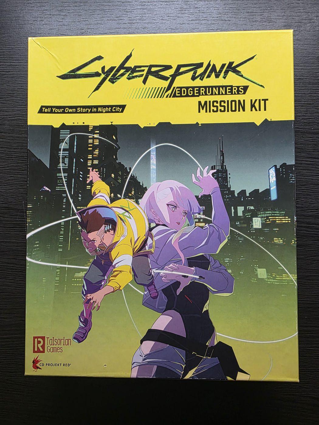 The yellow Cyberpunk Edgerunners Mission Kit box with David and Lucy on the cover