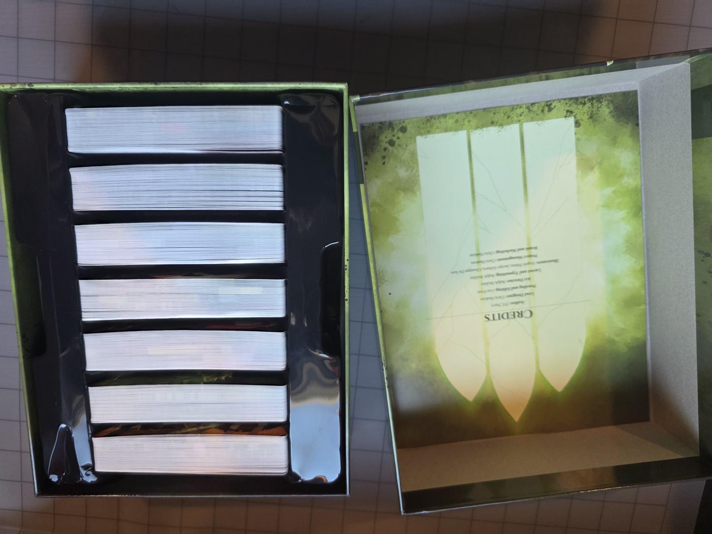 The open box holding seven decks, one per biome